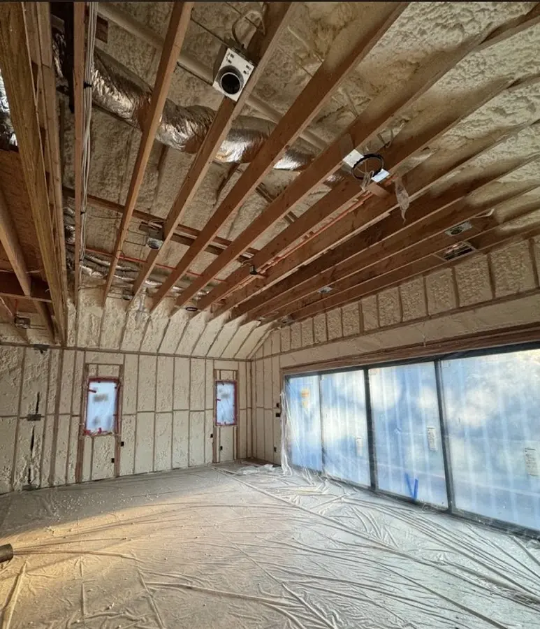 Interior walls and ceiling insulated with spray foam during new construction in Perkasie